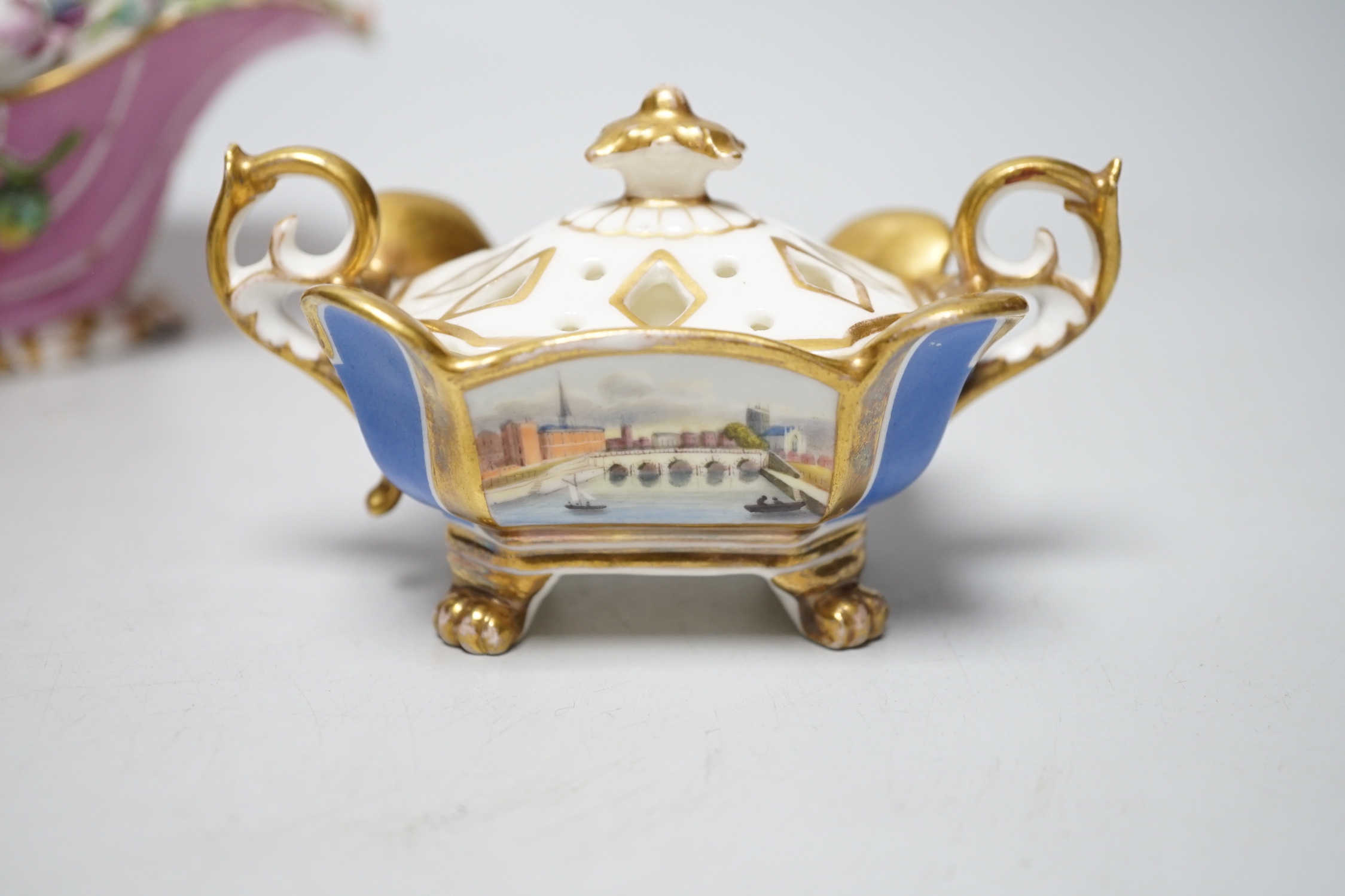 A Grainger Lee and co. miniature pot pourri vase with pierced cover, decorated with a view of Worcester Cathedral and the River Severn, on a blue ground, with two scroll handles and four paw feet and a Coalbrookdale flor